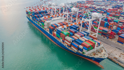 Aerial view crane shipping container, cargo container ship carrying container import and export business logistic and transportation.