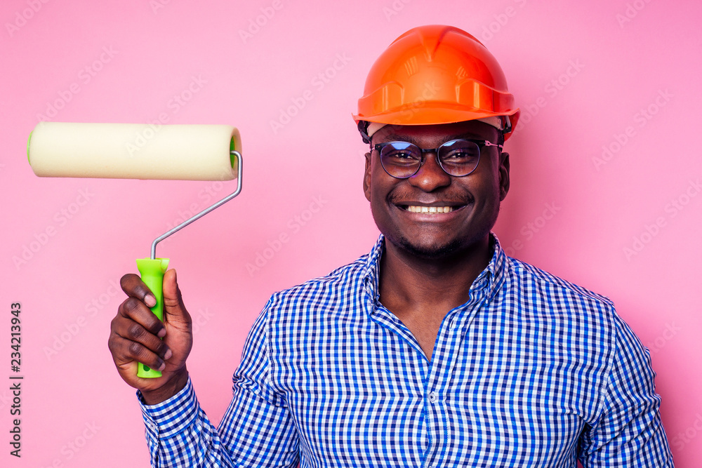 architect designer black man African American holding paint roller in