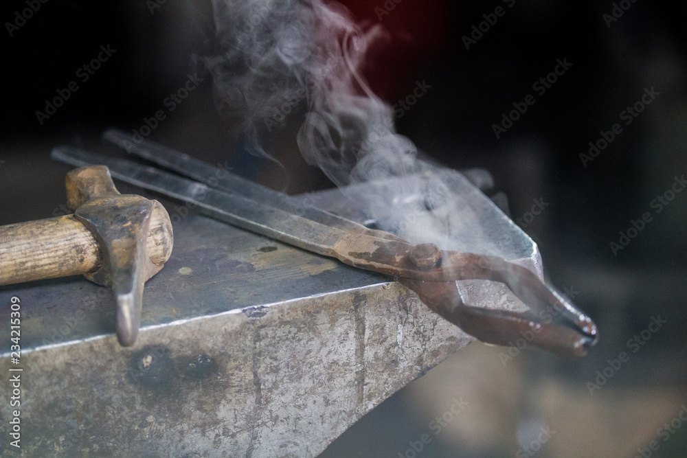 steam comes from the different tools lies on anvil steam comes from the different tools lies on anvil