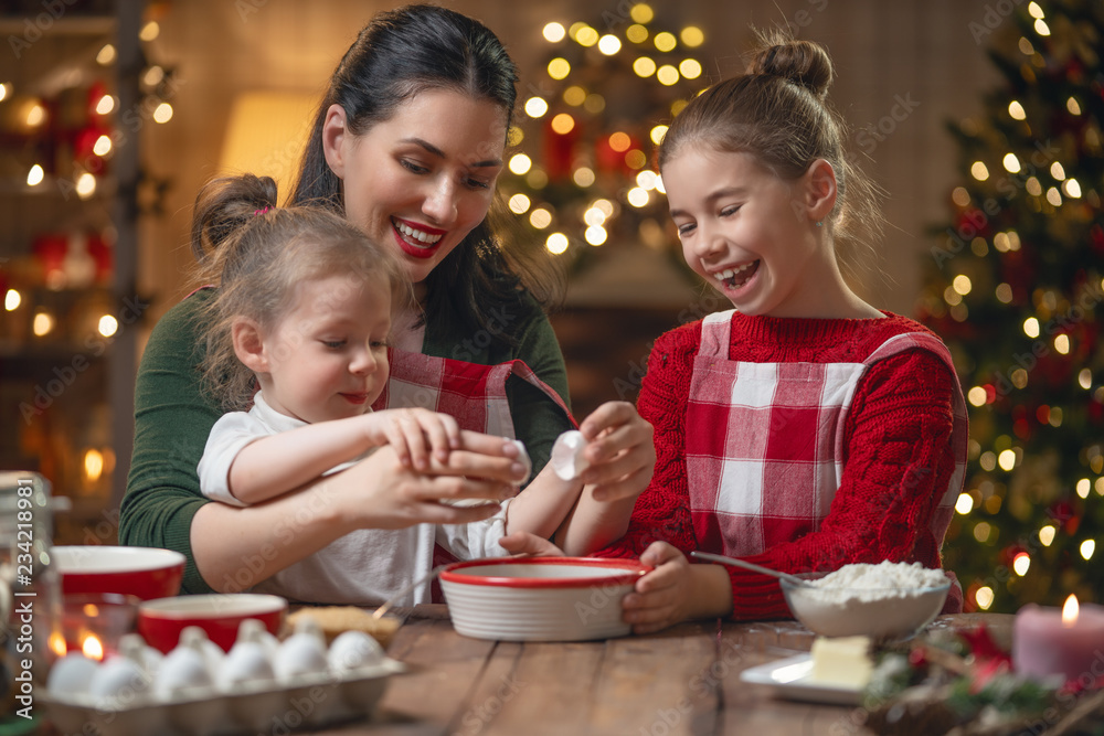 Family cooking Christmas cookies. Family cooking Christmas cookies.