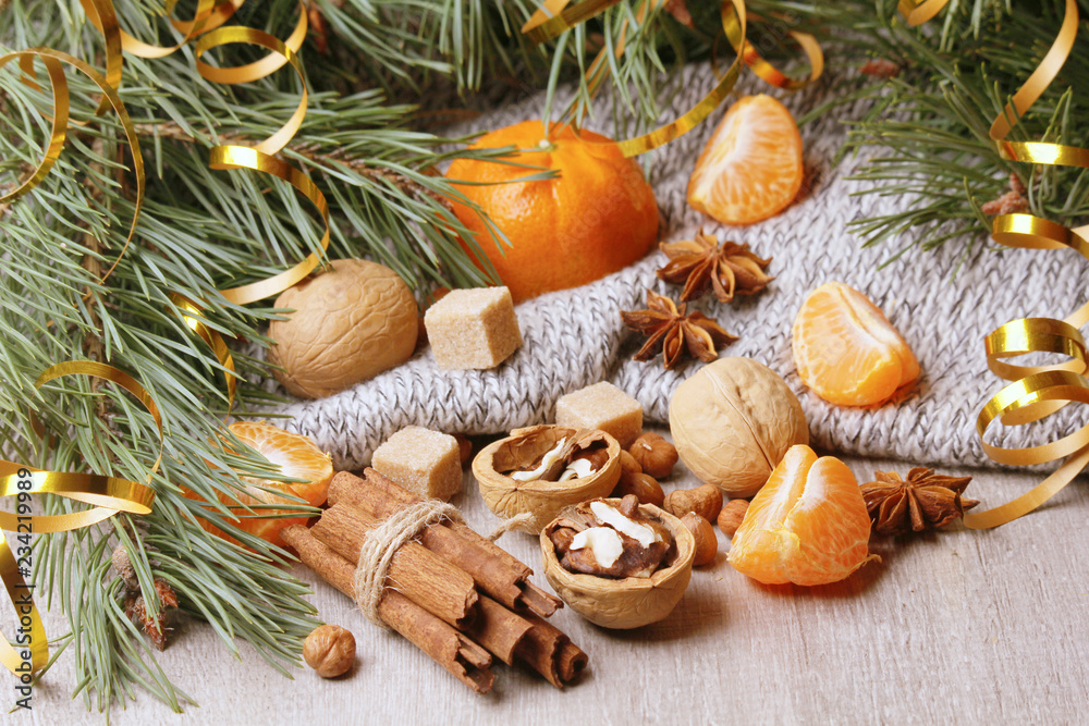 Still life composition formed with pine branches and New Year sweets Still life composition formed with pine branches and New Year sweets
