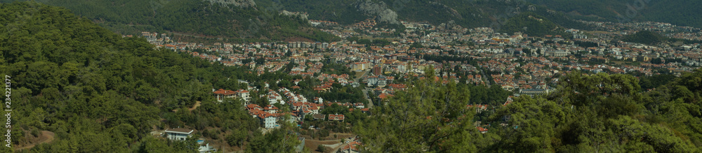 Nature landscape with a city by the shore of the sea between the hills. mountain town panorama