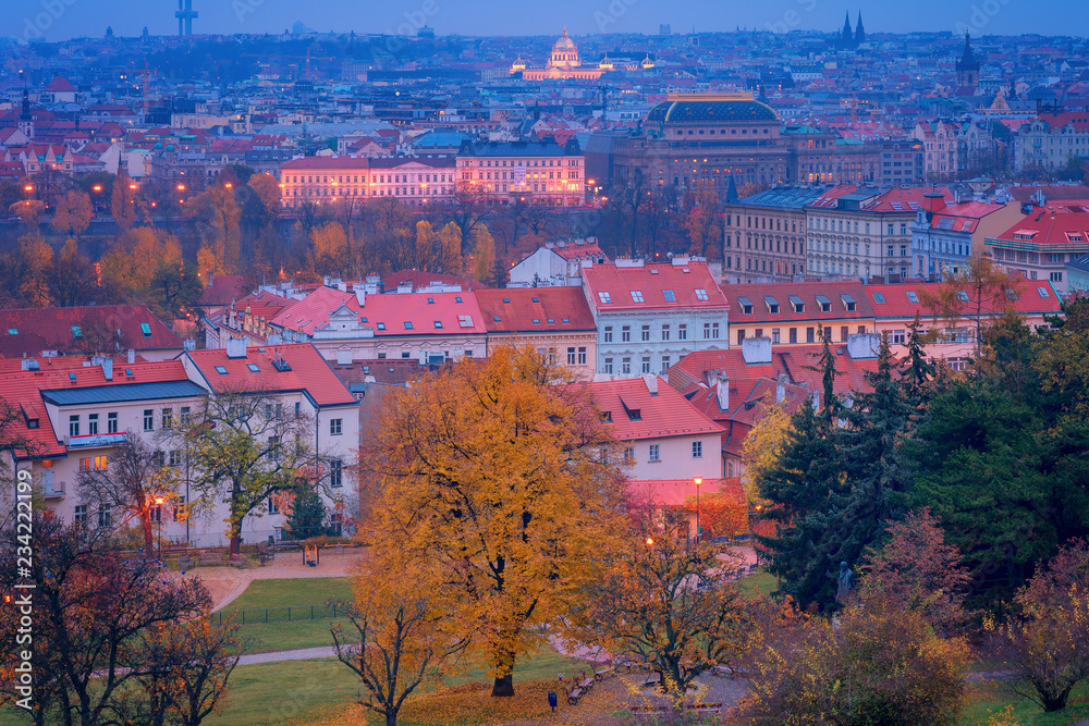 Beautiful view over Prague historical landmarks in autumn (fall) with yellow and orange leaves, Czech Republic, Europe