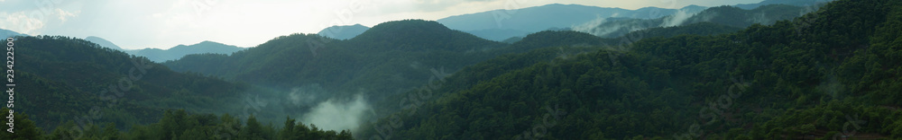 Mountain panorama with a dramatic sky background Mountain panorama with a dramatic sky background