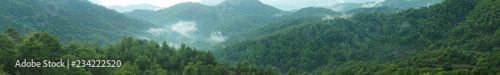 Mountain panorama with a dramatic sky background