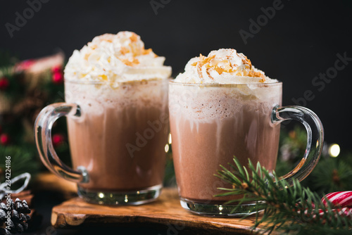 Christmas Hot Chocolate With Whipped Cream In Mug. Decorated With Golden Sugar Stars. Festive Christmas or Winter Holidays Drink, Comfort Food Concept