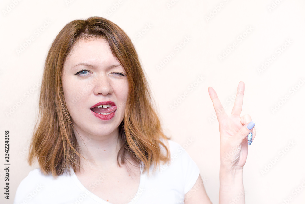 young woman with a funny facial expression young woman with a funny facial expression