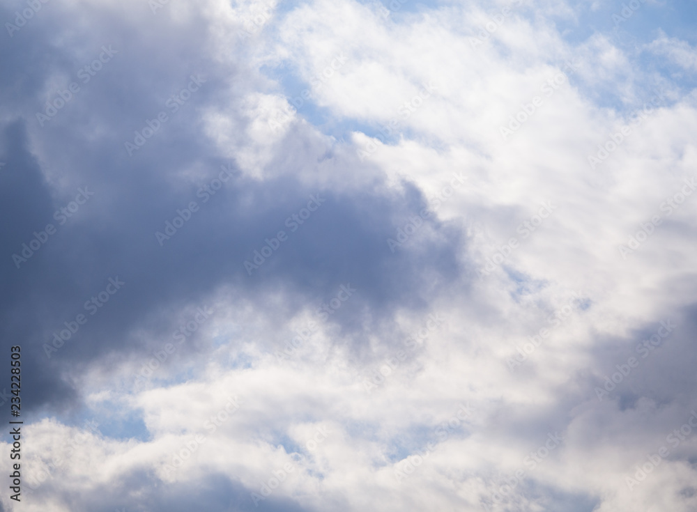 Blue sky background with white clouds.