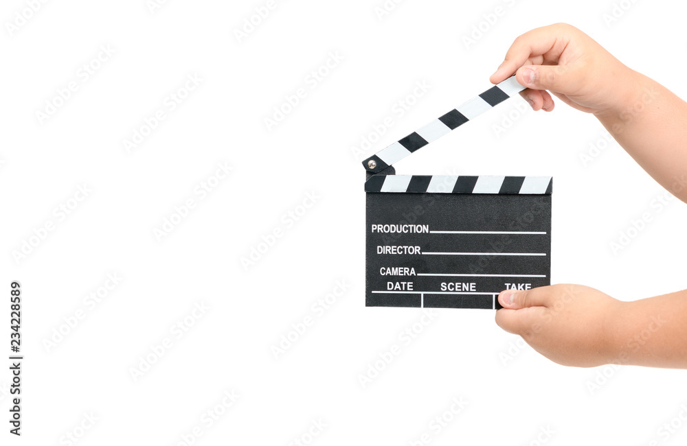 Naklejka premium Child holding movie clapper isolated on white