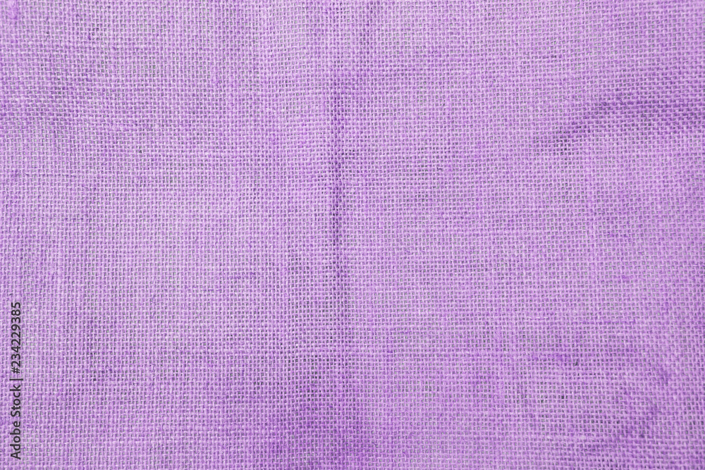 Fototapeta premium Abstract purple hessian fabric texture background