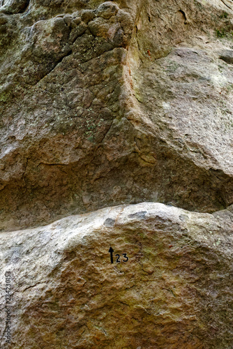 climbing sign on sandstone rock in Fontainebleau forest