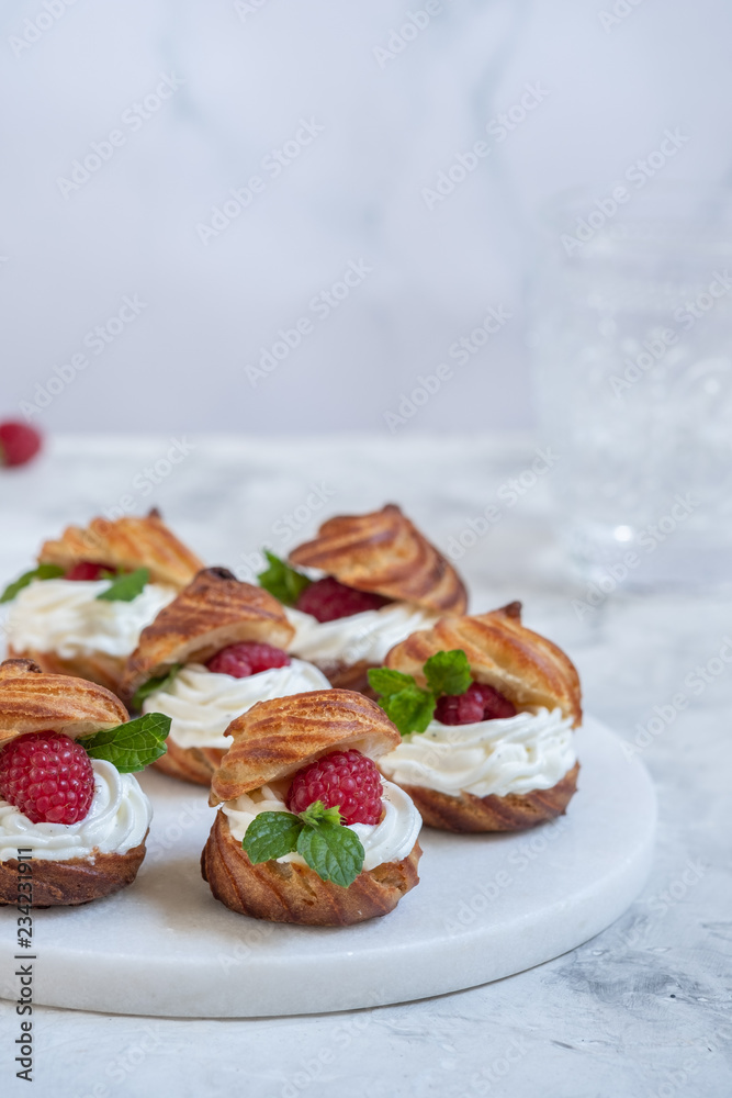 Raspberries Profiteroles with White Chocolate cream Raspberries Profiteroles with White Chocolate cream