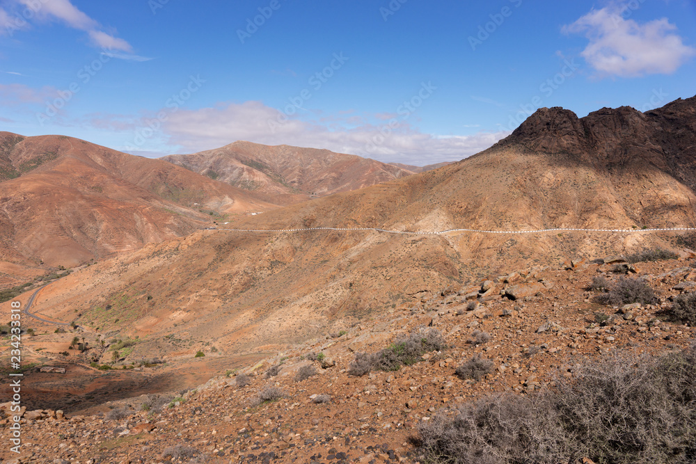 Rocky hill landscape with road in Fuerteventura. Canary Islands, Spain