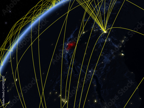 Rwanda on model of planet Earth at night with international networks. Concept of digital communication and technology. photo