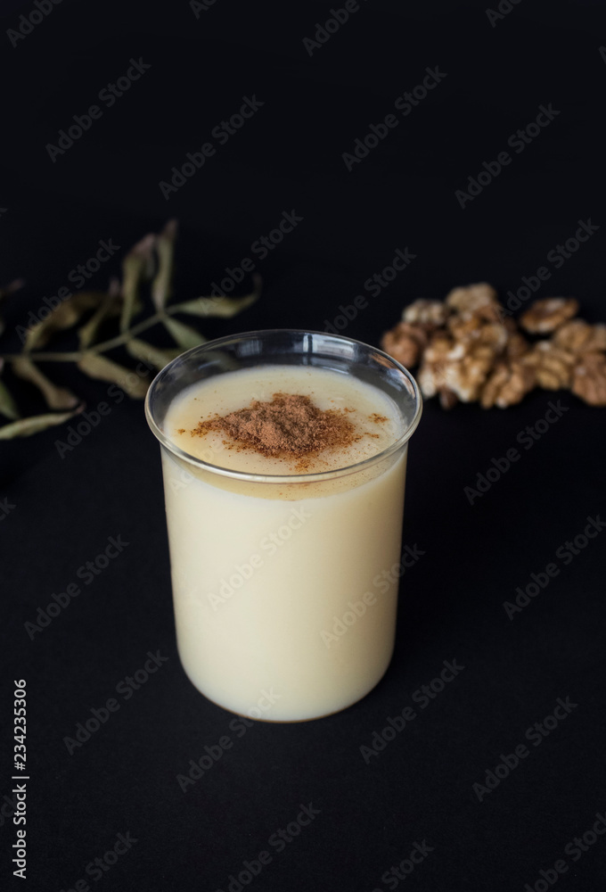 Traditional Turkish drink consumed frequently during winter months Boza or Bosa. Black background.