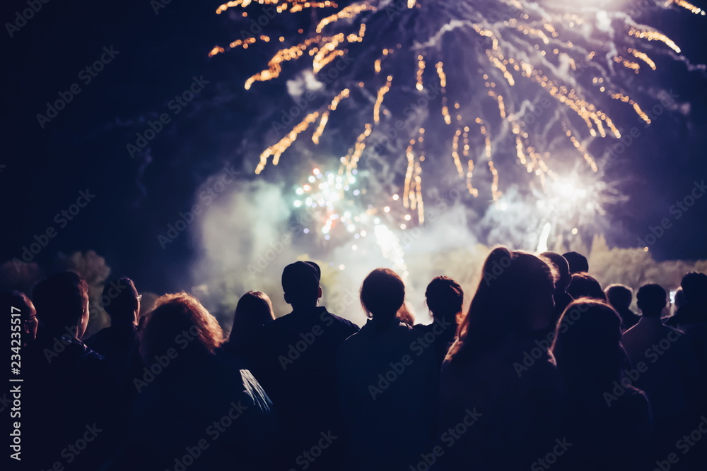 Crowd watching fireworks and celebrating new year eve