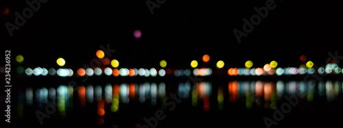 Light night at city bokeh blur abstract background. Blue black focus flare