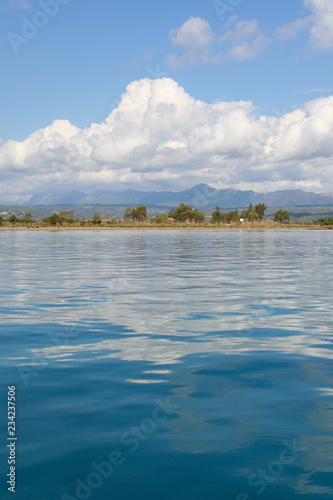 Beautiful blue mediterranean sea with clouds reflecting near Gialova, Greece