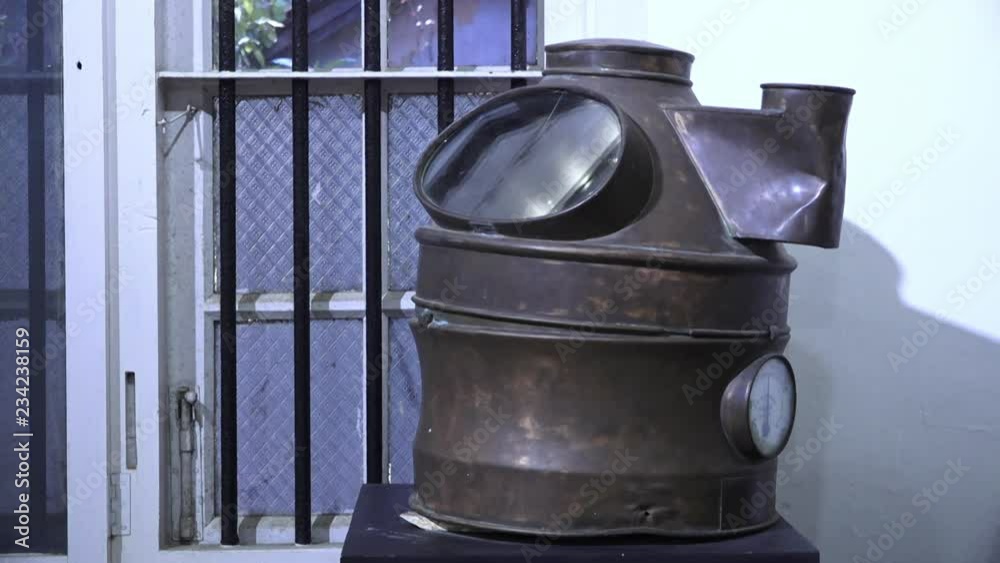 A close up shot of an antique furnace exhibited outside in the sun. A close up shot of an antique furnace exhibited outside in the sun.