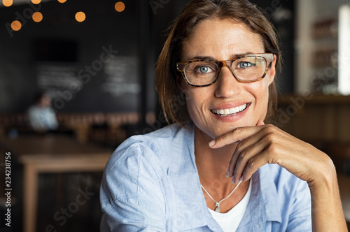 Happy mature woman wearing eyeglasses