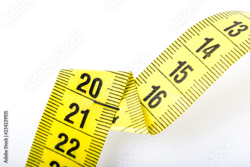 Measuring tape of the tailor for you design. On white background