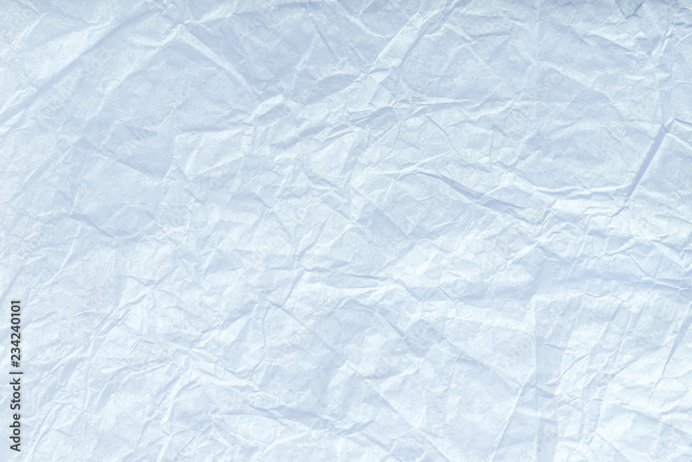 Texture of crumpled light blue wrapping paper, closeup. White old  background. Stock Photo