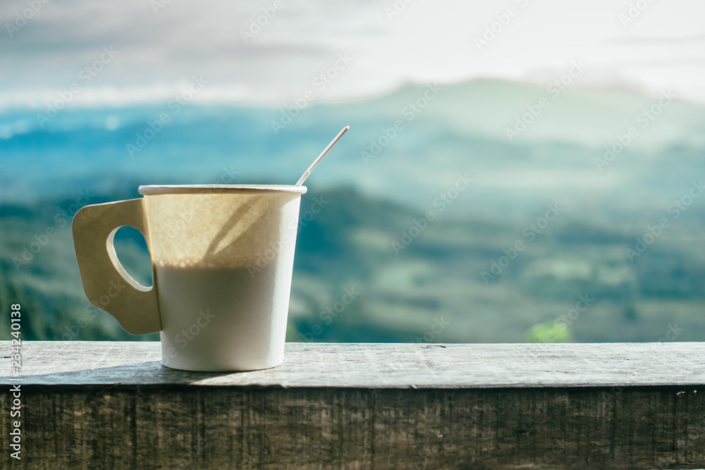 Hot Coffee in paper cups and mountain views in the morning. Hot Coffee in paper cups and mountain views in the morning.