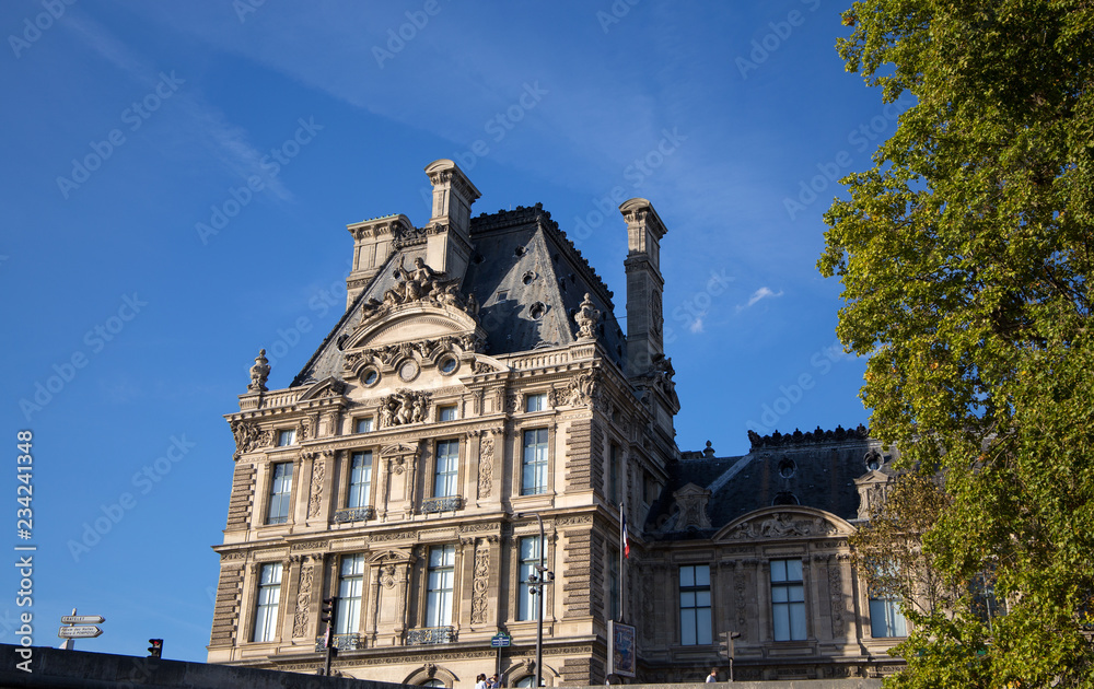 PARIS, FRANCE, SEPTEMBER 8, 2018 - Particular of facade of Louvre Museum, one of the most famous museums in the world, Paris, France