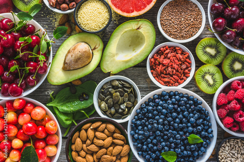 Healthy food selection, nuts, fruits and assortment of superfoods, top view