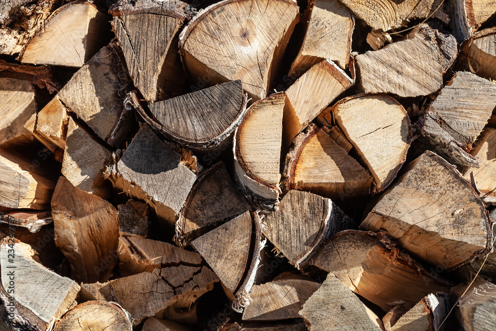Fototapeta premium Abstract photo of a pile of natural wooden logs background