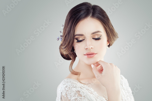Cute young woman with closed eyes