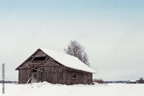 Old Barn Houses On The Snowy Fields