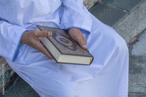 Middle age muslim man praying at mosque. photo