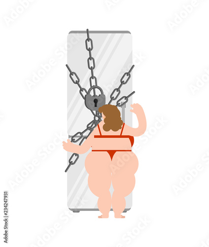 Closed refrigerator chain and fat woman. Diet concept. Large padlock. Stop food eating. Glutton prohibited