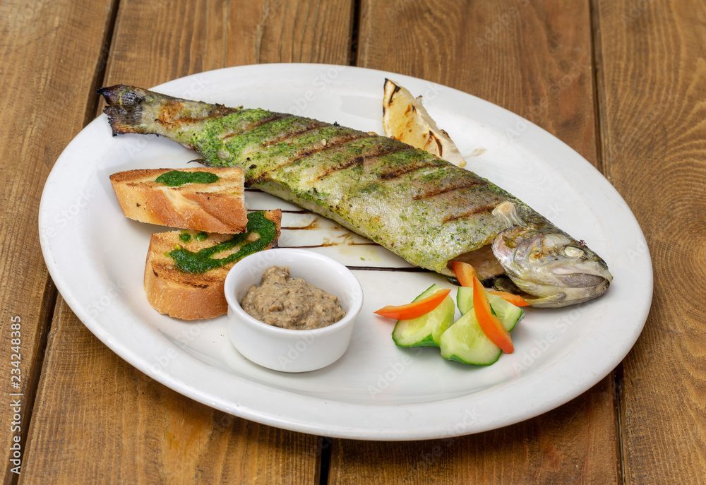 grilled fish on a plate grilled fish on a plate