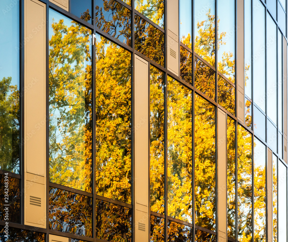 Abstract section of a modern building with a glass facade in which a ...