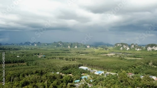 aerial footage drone flying over tropical mountains green forest fields meadows landscape near sea coast summer day Thailand Krabi Ao Nang 4k video photo