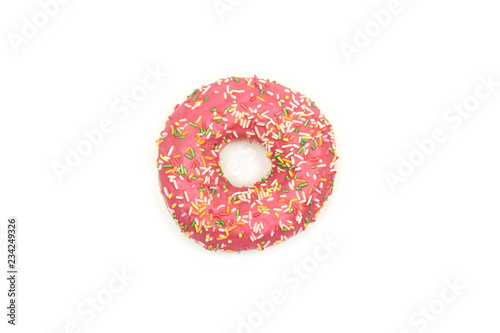Pink donut with colorful sprinkles isolated on white background.