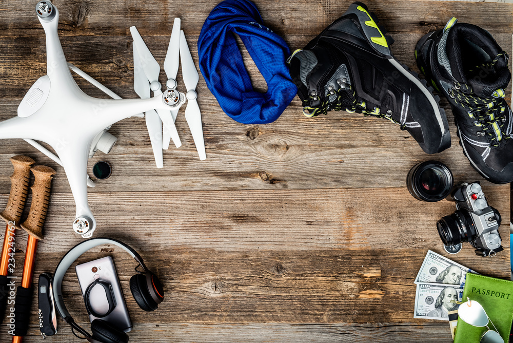 Travelling must have equipment on the wooden background