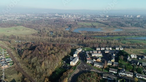 Aerial footage over the M74 motorway towards Motherwell on an early hazy winters day. photo