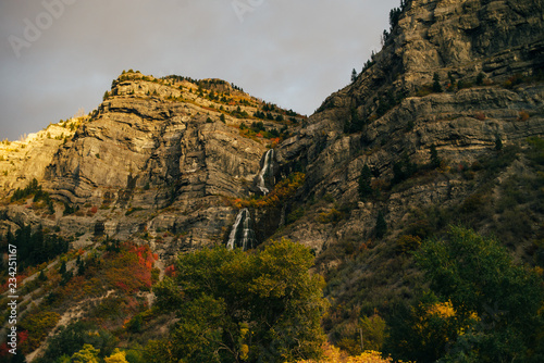 Sunset and rocks, covered in fall plants