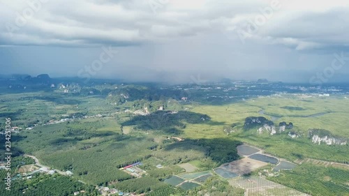 aerial footage drone flying over steep rugged mountains cliff green forest landscape summer day Thailand Krabi Ao Nang 4k video photo