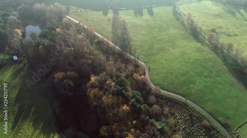 Aerial footage over Chatelherault hunting lodge on an early hazy winters day with a low sun throwing long shadows. photo