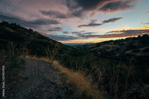 Fototapeta Naklejka Na Ścianę i Meble -  Deep colorful sunset over the hills