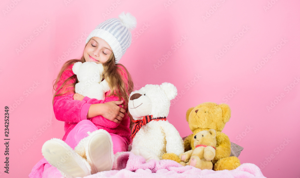 Child small girl playful hold teddy bear plush toy. Why kids love stuffed animals. Kid little girl play with soft toy teddy bear on pink background. Toy every child dreaming. Happy childhood concept Child small girl playful hold teddy bear plush toy. Why kids love stuffed animals. Kid little girl play with soft toy teddy bear on pink background. Toy every child dreaming. Happy childhood concept