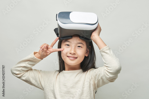 Smiling girl with glasses of virtual reality
