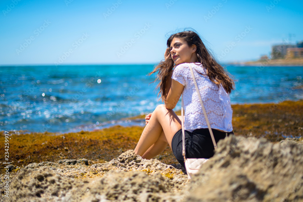 Young teenager girl at the beach