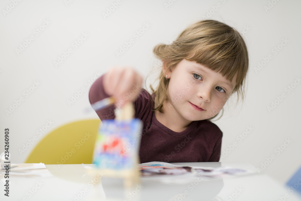 little girl painting on canvas little girl painting on canvas