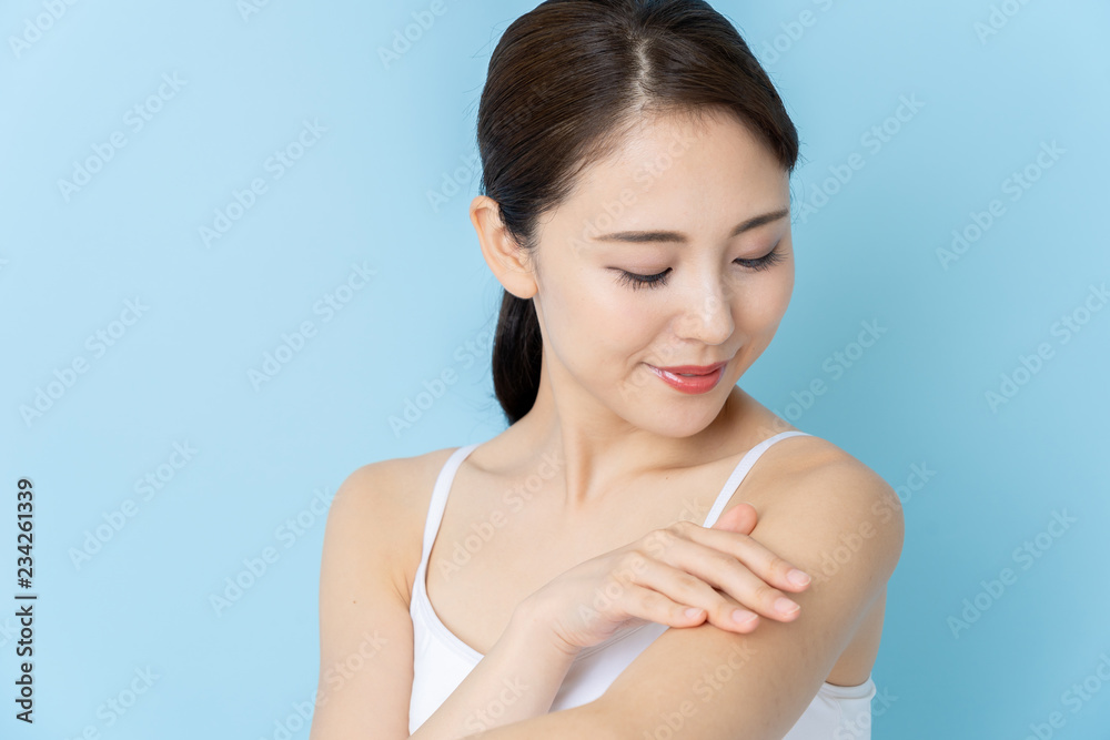 attractive asian woman beauty image on blue background attractive asian woman beauty image on blue background