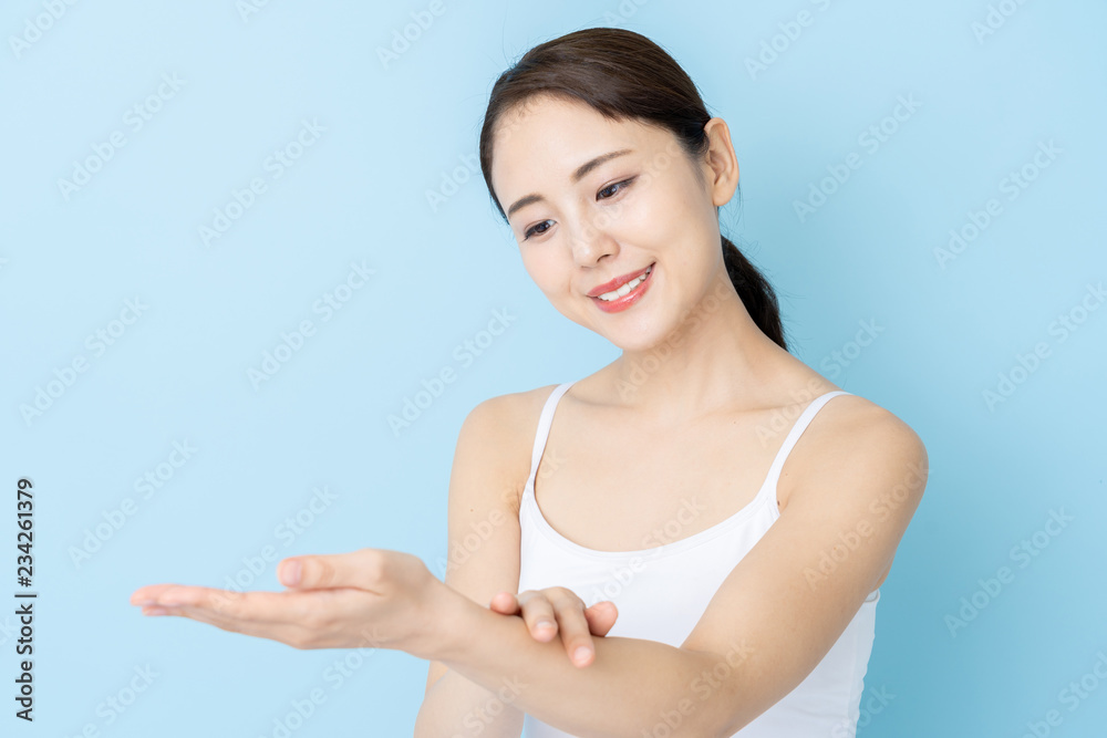 attractive asian woman beauty image on blue background attractive asian woman beauty image on blue background